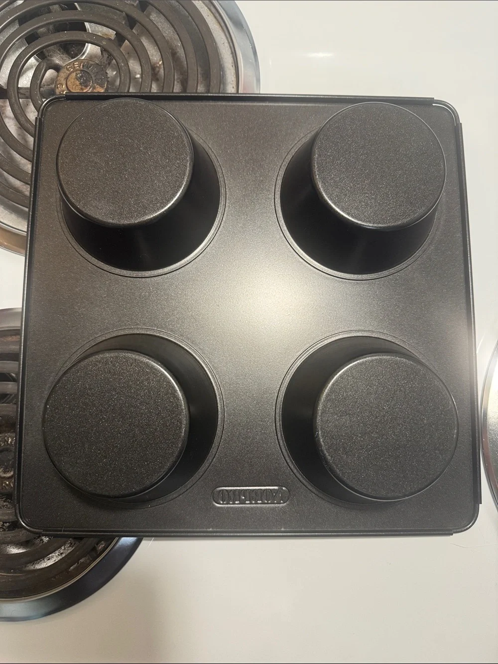Two muffin pans, the large one is non-stick and NWOT. Small one is in GUC.